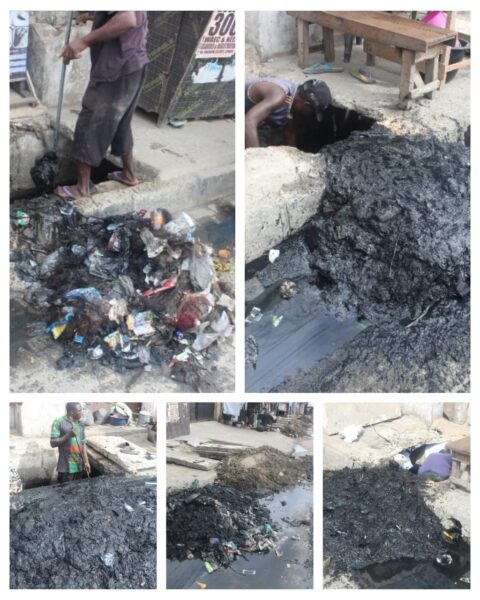 Council environmental team desilting drainage channels in Coker-Aguda